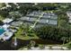 Aerial view of community featuring multiple tennis courts and lush landscaping at 805 Montrose Dr # 203, Venice, FL 34293