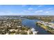 Breathtaking aerial view showcasing waterfront property with lush landscaping and serene water views at 807 Lucille Ave, Nokomis, FL 34275