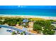 Beautiful high shot of the beach and dunes area along the beach featuring parking, a bath house, and greenery at 807 Lucille Ave, Nokomis, FL 34275