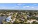 Aerial view of home, gazebo and surrounding neighborhood with water access at 807 Lucille Ave, Nokomis, FL 34275