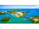 Gorgeous aerial shot capturing waterfront homes, the intercoastal, marina, and access bridges at 807 Lucille Ave, Nokomis, FL 34275