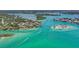 Beautiful aerial view of waterfront homes and boaters enjoying the Gulf of Mexico at 807 Lucille Ave, Nokomis, FL 34275