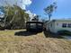 Backyard featuring a cozy gazebo next to the house at 807 Lucille Ave, Nokomis, FL 34275