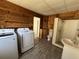 A bathroom laundry room combination including shower, toilet, vanity and new washer and dryer at 807 Lucille Ave, Nokomis, FL 34275