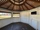 Interior of gazebo, with wood ceiling, floor, and 3 windows at 807 Lucille Ave, Nokomis, FL 34275