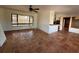 Bright living room featuring terra cotta floors, a large window, and an open layout at 807 Lucille Ave, Nokomis, FL 34275