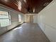 A well-lit living room with a ceiling fan, neutral walls, and tile flooring at 807 Lucille Ave, Nokomis, FL 34275