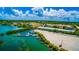 Picturesque waterfront living featuring boat docks, a modern condominium, and beautiful landscaping at 807 Lucille Ave, Nokomis, FL 34275