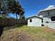 Backyard with a shed surrounded by fencing at 807 Lucille Ave, Nokomis, FL 34275