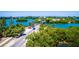 Street view over bridge surrounded by mature trees with tranquil water views, a great place to live at 807 Lucille Ave, Nokomis, FL 34275