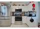 Modern kitchen featuring stainless steel appliances and plenty of cabinet space at 8475 Chesapeake Ave, North Port, FL 34291