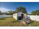 Outdoor shed featuring a workbench, overhead storage, and easy access at 8475 Chesapeake Ave, North Port, FL 34291