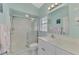 Bright bathroom with shower, white vanity, and neutral tones at 9204 L Pavia Blvd # 9204, Venice, FL 34292