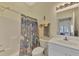 Bathroom features shower, white vanity, and a view into the bedroom at 9204 L Pavia Blvd # 9204, Venice, FL 34292