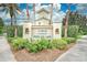 Elegant community sign surrounded by lush landscaping and mature trees at 9204 L Pavia Blvd # 9204, Venice, FL 34292