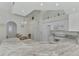 Close-up of the kitchen's marble countertops, modern appliances, and spacious breakfast bar at 9204 L Pavia Blvd # 9204, Venice, FL 34292