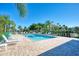 Community pool area featuring crystal clear water and plenty of lounge chairs at 9204 L Pavia Blvd # 9204, Venice, FL 34292