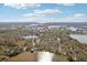 Aerial shot of a community surrounding lakes and trees at 9790 Parkwood Ct, Seminole, FL 33777