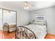 Comfortable bedroom with a window and hardwood flooring at 9790 Parkwood Ct, Seminole, FL 33777