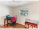 Bedroom with a desk, hardwood flooring and window at 9790 Parkwood Ct, Seminole, FL 33777