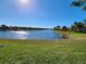 Backyard overlooking lake, showcasing the serene outdoor space at 13892 Alafaya St, Venice, FL 34293