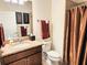 Bathroom with vanity, granite countertop, and tiled shower with curtain at 13892 Alafaya St, Venice, FL 34293