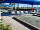 Community bocce ball court with multiple courts, seating, and shaded areas for players at 13892 Alafaya St, Venice, FL 34293