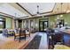 Inviting clubhouse bar area with golf course views, TVs, and comfortable seating at 10181 Colubrina Dr, Venice, FL 34293