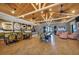 Large common area with coffee bar, tables, seating, herringbone floors, and paneled wood ceilings at 10181 Colubrina Dr, Venice, FL 34293