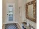 Charming entryway with decorative mirror and nautical decor at 10181 Colubrina Dr, Venice, FL 34293