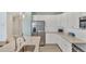 Spacious kitchen with stainless steel appliances, breakfast bar, and ample counter space at 10181 Colubrina Dr, Venice, FL 34293