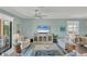 Bright living room featuring a large TV, stylish decor, and plenty of seating at 10181 Colubrina Dr, Venice, FL 34293