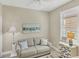 Cozy living room with modern decor and nautical themed furnishings at 10181 Colubrina Dr, Venice, FL 34293