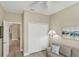 Comfortable living area showcasing neutral tones and an artful wall display at 10181 Colubrina Dr, Venice, FL 34293