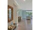 Bright and airy living space with lake view and modern nautical decor throughout the home at 10181 Colubrina Dr, Venice, FL 34293