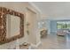 Bright and airy living space with lake view and modern nautical decor throughout the home at 10181 Colubrina Dr, Venice, FL 34293