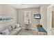 Cozy office with a sofa, tv and beach themed decor at 10181 Colubrina Dr, Venice, FL 34293