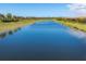 Scenic water view overlooking a long lake behind a neighborhood at 10181 Colubrina Dr, Venice, FL 34293