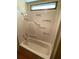 Bathroom featuring a bathtub with motivational wording, white walls, and chrome fixtures at 105 Lakeview Dr, North Port, FL 34287