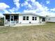 Charming single-story home with a well-maintained lawn and cozy porch, perfect for enjoying peaceful outdoor living at 105 Lakeview Dr, North Port, FL 34287