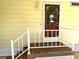 Welcoming front porch features decorative railing and a secure front door with a decorative window at 105 Lakeview Dr, North Port, FL 34287