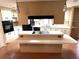 Well-lit kitchen featuring a central island with cooktop, abundant counter space, and modern appliances for easy meal prep at 105 Lakeview Dr, North Port, FL 34287