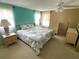 Cheerful main bedroom featuring a decorative bed frame, coordinating bedding, and bright walls at 105 Lakeview Dr, North Port, FL 34287