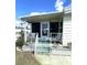 Charming porch with seating and decorative swan accents, offering a relaxing spot to enjoy the outdoors at 105 Lakeview Dr, North Port, FL 34287