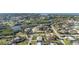 Panoramic aerial view of a waterfront community with lush greenery and well-maintained homes at 1160 Linden Rd, Venice, FL 34293