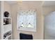 Bright bathroom with a patterned window treatment, a black vase on shelving, and a shower stall at 1181 Southland Rd, Venice, FL 34293