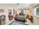 Bedroom featuring a cozy bed, decorative rug, and soft lighting for a relaxing ambiance at 1181 Southland Rd, Venice, FL 34293