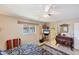 Bedroom with a plush bed, tile floors, and an ensuite bathroom at 1181 Southland Rd, Venice, FL 34293
