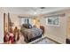 Cozy bedroom with a comfortable bed, stylish decor, and ample natural light from the window at 1181 Southland Rd, Venice, FL 34293