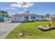 Lovely single-story home with vibrant lawn, attached garage, and delightful nautical decor at 1181 Southland Rd, Venice, FL 34293